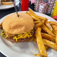 Vegan S-Curve Popper Burger with Beyond patty and side of fries.  Burger topped with grilled jalepenos, vegan bacon, vegan cream cheeze, and vegan mayo at Ocala's Downtown Diner in Ocala