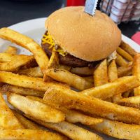 Vegan S-Curve Popper Burger with Beyond patty and side of fries.  Burger topped with grilled jalepenos, vegan bacon, vegan cream cheeze, and vegan mayo at Ocala's Downtown Diner in Ocala