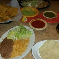 Rice, beans, chips, guac, red salsa and green sauce! at La Casita Mexican Restaurant in Collins