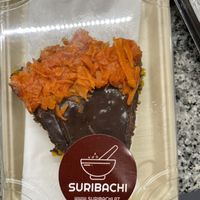 Bolo de cenoura com cobertura de chocolate e doce de cenoura por cima. Delicioso!  at Suribachi in Porto