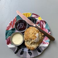  Vegan scone with jam and cream  at East Village Cafe in Bristol