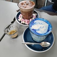 Fancy drinks. Biscoff hot chocolate and lavender spirulina latte at East Village Cafe in Bristol