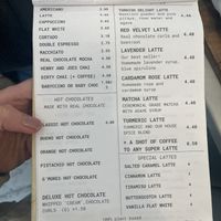 Menu items: coffee, hot chocolates and lattes  at East Village Cafe in Bristol