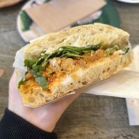 Buffalo Chickpea Toasted Sandwich   at East Village Cafe in Bristol