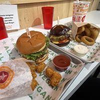 double smash patty fire burger with ghost sauce and a pub cheeze burger sub for a black bean patty with tots and onion rings  at Next Level Burger - Concord in Concord
