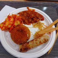 Gulash, kimchi, nem, fried mushed potato at Loving Hut - Spalena in Prague