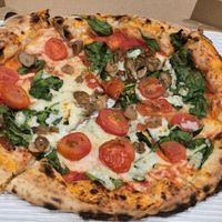 Gabriele: vegan cheese, spinach, cherry tomatoes, mushrooms at Officine Buona Forchetta in San Diego