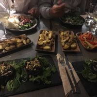 Stuffed portobello mushrooms, roasted potatoes with rosemary & sea salt, seasoned mixed veggies at Bubbles and Bites in Cascais