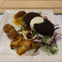 Special vegetarian plate (off menu item recommended by the waiter): polenta, roast potatoes, grilled vegetables, salad, 2 beetroot burgers  at Klopa in Sarajevo