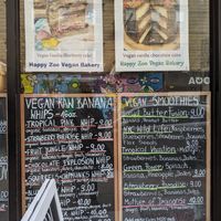 Menus outside at Happy Zoe Vegan Bakery in Brooklyn