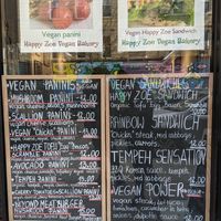 Menus outside at Happy Zoe Vegan Bakery in Brooklyn
