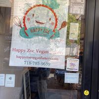Front door, with Happy Cow sticker at Happy Zoe Vegan Bakery in Brooklyn