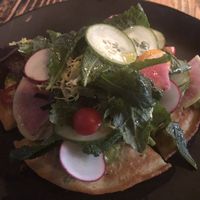 Chickpea pancake topped with salad.  Tasty but heavy.  Best thing I tried.  at XYST in New York City