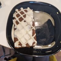 Warm gingerbread cake with cream at Hillgate Cakery in Stockport