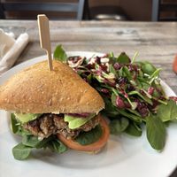 Vegan burger with side spinach salad $22  at The Food and Art Cafe in Whitby