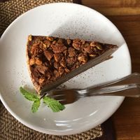 CREPE CAKE! Crunchy, sweet, cocoa powdered nuts over a THICK slice of chocolate crepe and vanilla cream layers at Goodsouls Kitchen in Chiang Mai