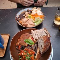 Ovenschotel met bechamelsaus, aubergine, bonen ernaast en zuurdesembrood at Het Strand - The Strand in Leuven