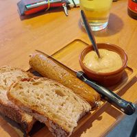 Seitan sausage with bread and mustard at Het Strand - The Strand in Leuven
