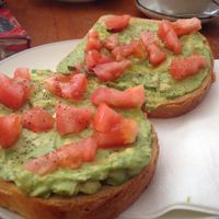Avocado toast, with chilli flakes and tomato. at Cafe Beit in Brooklyn