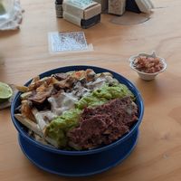 Papas bravas with lots of sauces at Cherry's Cocina in Pereira