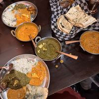 Sharing three different types of curries, two different types of naan, and some rice.   at Shandhar Hut in Chilliwack