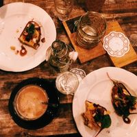 scrambled egg toast with almond cappuccino at Kuddelmuddel Cafe  in Berlin