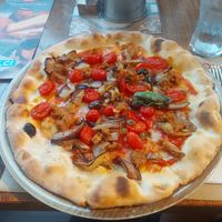 Vegan pizza with eggplant and vegan sausage at Rossopomodoro in Trieste