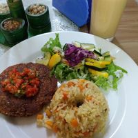 Lentil patty, rice with carrots and a salad. at Itagui Casa Naturista in Medellin
