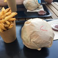 The meal - fries, homemade ketchup, burger and drink   at O'Local Restaurant in Brest