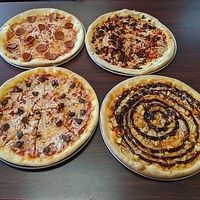 Pepperoni, Chorizo, Impossible, and BBQ chicken pizza  at Veganos Kitchen in Las Vegas