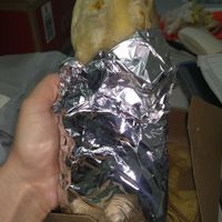 Huge, tasty burrito with homemade chips on the side!  at Veganos Kitchen in Las Vegas