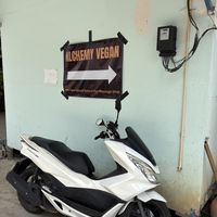 look for signs to direct you from the massage parlor   at Alchemy Vegan in Chiang Mai