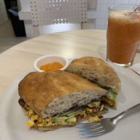 Tofu and beans sandwich with strawberry juice at Pulpa Amor Liquido  in Mexico City