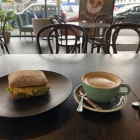 Brekky ciabatta (scrambled tofu, hash brown, lettuce, bbq sauce) and soy flat white   at Raw Sugar Cafe in Christchurch