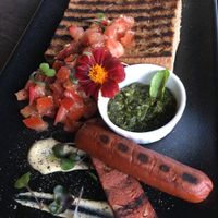 Toast with bruschetta, pesto, and sausage (all vegan).  at Raw Sugar Cafe in Christchurch