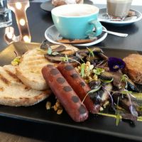 Scrambled tofu, vegan sausage, mushrooms and rosti. at Raw Sugar Cafe in Christchurch