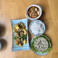 Three dishes and rice   at Achi Vegan House in Hanoi