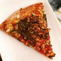 Zucchini pesto pizza at Pastelería y Panadería Sinfonía in Santiago
