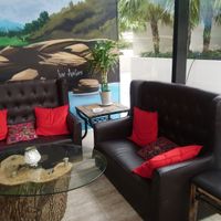 Inside comfy seating at Artichoke & Vine in Boca Raton