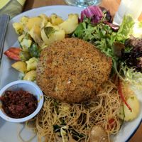 Thai burger with harissa sauce and side salads at Henderson's Shop and Salad Table in Edinburgh