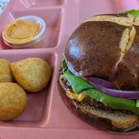 Veggy eleven burger and half of the jalapeno poppers at Veggy Street in Las Vegas