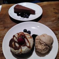 Apple toffee doughnut with caramel nice cream and a raw ganache cake at Vantra Vegan in London