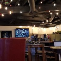 Fun atmosphere inside. All of the high tables are cheese boards. at Kagen Coffee & Crepes in Richland