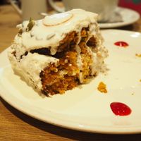 Vegan Carrot Cake [£4.50] served with a side of plant milk  at Henderson's Restaurant in Edinburgh