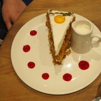 Vegan Carrot Cake [£4.50] served with a side of plant milk  at Henderson's Restaurant in Edinburgh