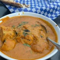 Soya chunks in curry sauce and a vegan paratha flat bread (only half of it showing in photo)   at Indian Kitchen in Golden