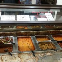 We visited this Indian Restaurant in Mesa, AZ on Dec 1, 2017 for the first time, It’s a nice place, with a dinner buffet. There are clearly marked portions of the buffet for Vegan options.
The food all tasted great, they had many Vegan options, but also some meat. They bring fresh made breads to the table as you eat. There was chai tea & mango juice as well as some sweets. Friendly staff. They were open late 10pm

More Pics 
http://whatdoyoueatthen.com/india-oven-mesa-az/ at India Oven in Mesa