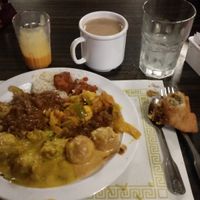 We visited this Indian Restaurant in Mesa, AZ on Dec 1, 2017 for the first time, It’s a nice place, with a dinner buffet. There are clearly marked portions of the buffet for Vegan options.
The food all tasted great, they had many Vegan options, but also some meat. They bring fresh made breads to the table as you eat. There was chai tea & mango juice as well as some sweets. Friendly staff. They were open late 10pm

More Pics 
http://whatdoyoueatthen.com/india-oven-mesa-az/ at India Oven in Mesa