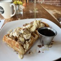 The amazing vegan waffles with Almonds, peanut butter, and sliced banana  at Iron Roost in Ballston Spa