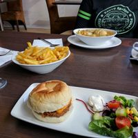 Pulled pork burger with fries. Veg stew with dumplings. at Phoenix Plant Based Eatery in Prescot